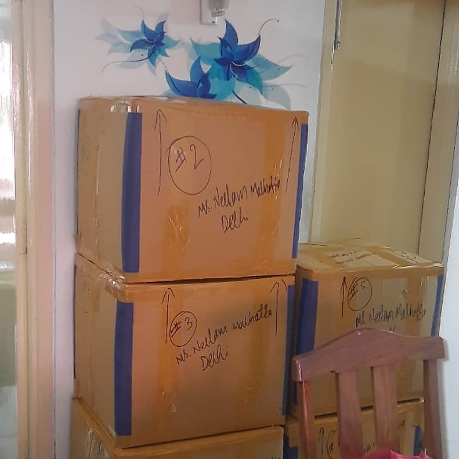 Numbered cartons stacked and sealed in storage